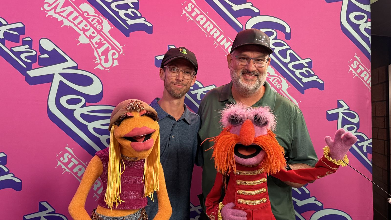 Crew posing with Muppets characters at the Rock 'n' Roller Coaster Starring the Muppets event